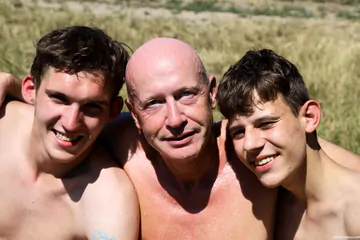 Old bald man having a threesome