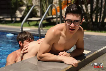 Guys in a pool having sex