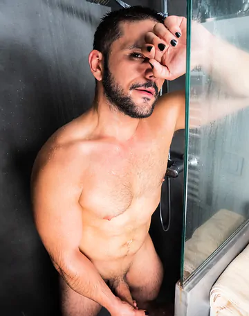 Man in a bathroom masturbating