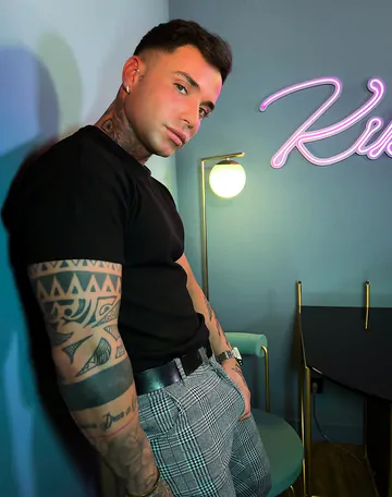 Tattooed guy with a shaved cock