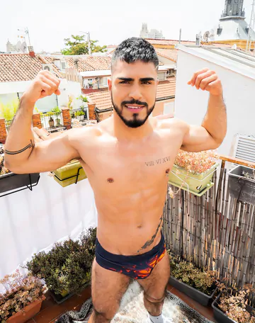 Guy on a rooftop taking a shower