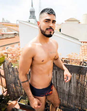 Guy on a rooftop taking a shower