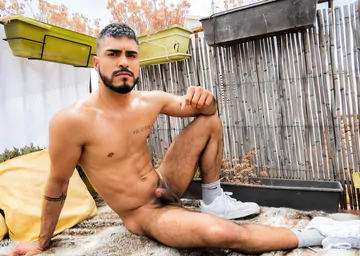 Guy on a rooftop taking a shower