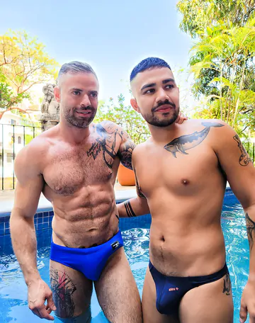 Tattooed man fucking ass bareback