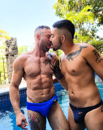 Tattooed man fucking ass bareback