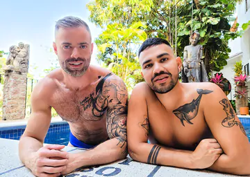 Tattooed man fucking ass bareback