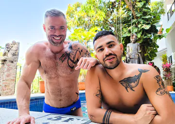 Tattooed man fucking ass bareback