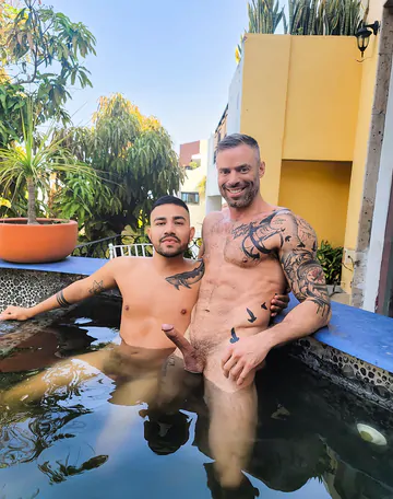 Tattooed man fucking ass bareback