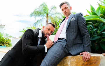 Guys in suits fucking in a pool