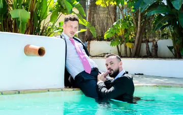 Guys in suits fucking in a pool