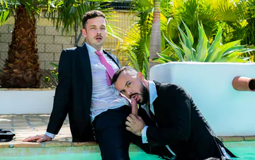 Guys in suits fucking in a pool