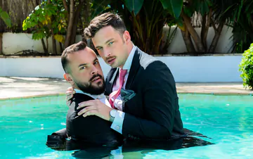 Guys in suits fucking in a pool
