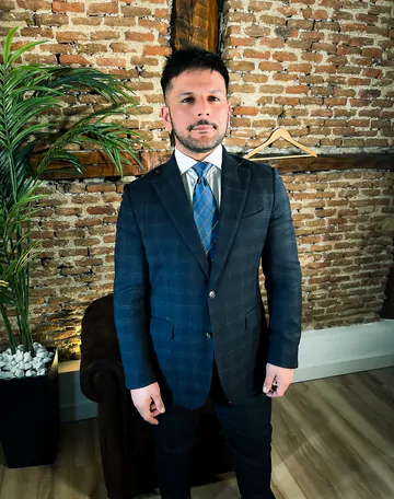 Man in a suit takes his dick out