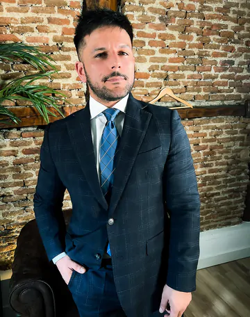 Man in a suit takes his dick out