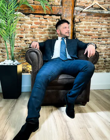 Man in a suit takes his dick out