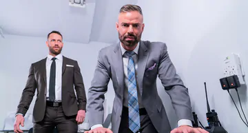 Men in suits having gay sex