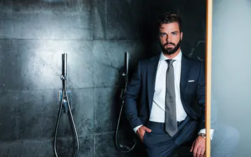 Guys in suits taking a shower