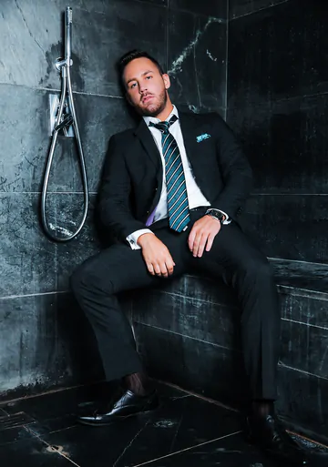 Guys in suits taking a shower