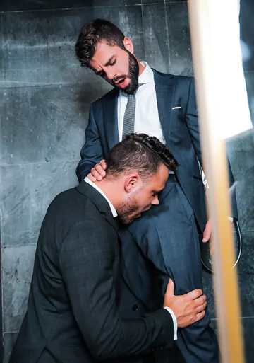 Guys in suits taking a shower