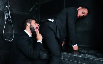 Guys in suits taking a shower