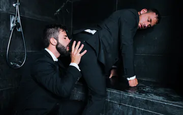 Guys in suits taking a shower