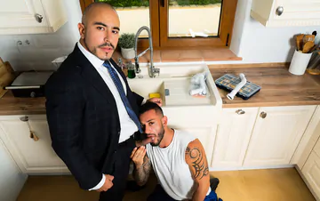 Business man in a kitchen gets fucked