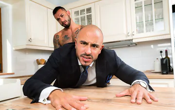 Business man in a kitchen gets fucked