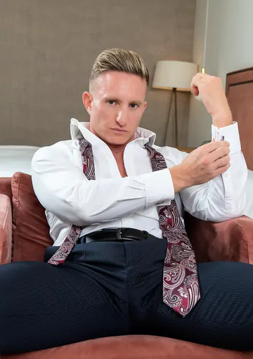 Man in a suit masturbating