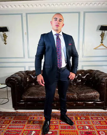 Bald muscular guy showing his goods