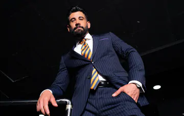 Men in blue suits getting naughty