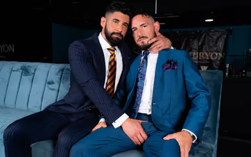 Men in blue suits getting naughty