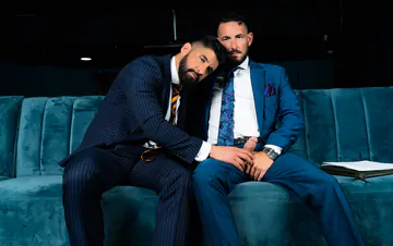 Men in blue suits getting naughty