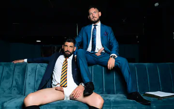 Men in blue suits getting naughty