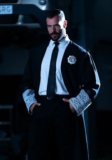 Men in a garage having gay sex