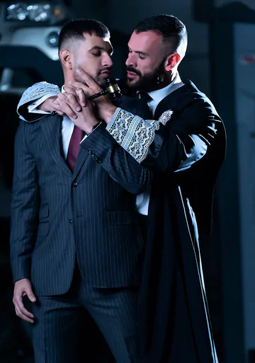 Men in a garage having gay sex