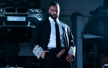 Men in a garage having gay sex