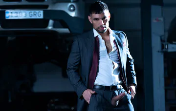 Men in a garage having gay sex