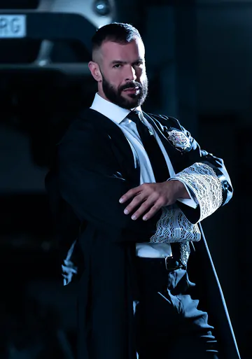 Men in a garage having gay sex