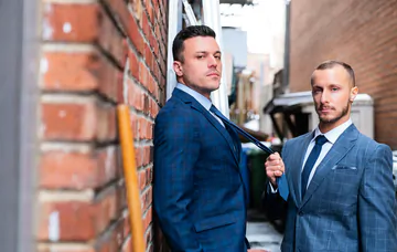 Men having sex in an alley