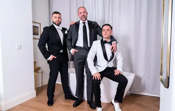 Well dressed guys having a threesome