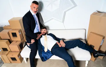 Men in a warehouse having sex