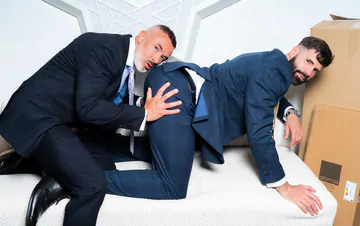 Men in a warehouse having sex