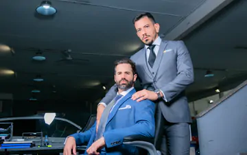 Car salesmen having gay sex