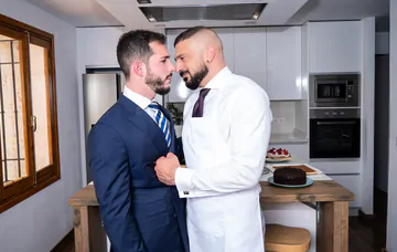 Men in a kitchen having sex