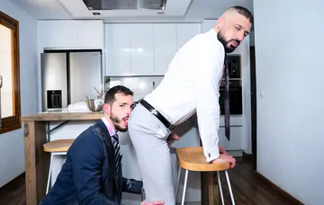 Men in a kitchen having sex
