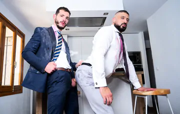 Men in a kitchen having sex
