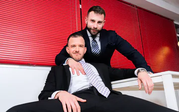 Men in suits having gay sex