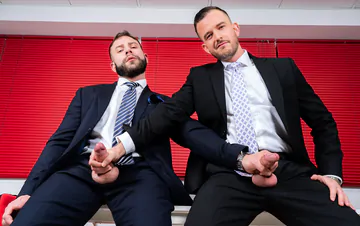 Men in suits having gay sex