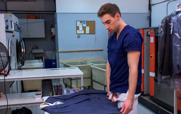 Men in a laundry having sex