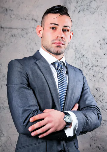 Men in suits fucking on a sofa